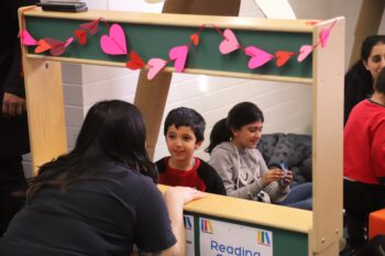 Enchanting Moments: Kids Engaged in Reading at the Cozy Story Corner, British Columbia